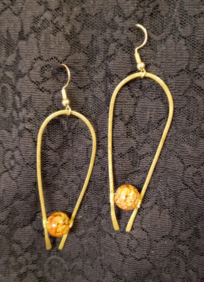 gold horseshoe shape orange marbled balls